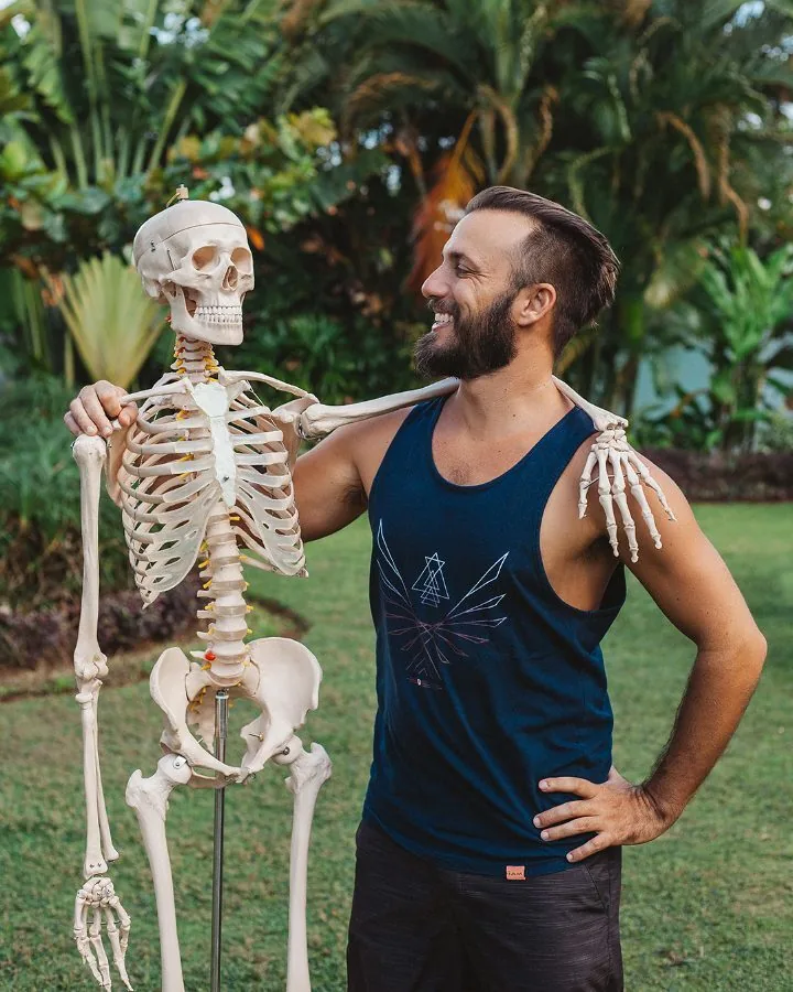 A teacher with an anatomy skeleton model