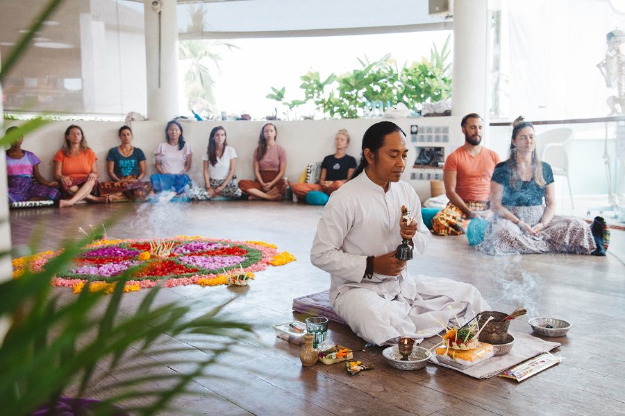 A Balinese blessing ceremony with a flower mandala