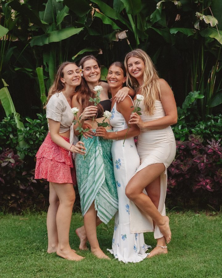 Graduates with roses in the garden