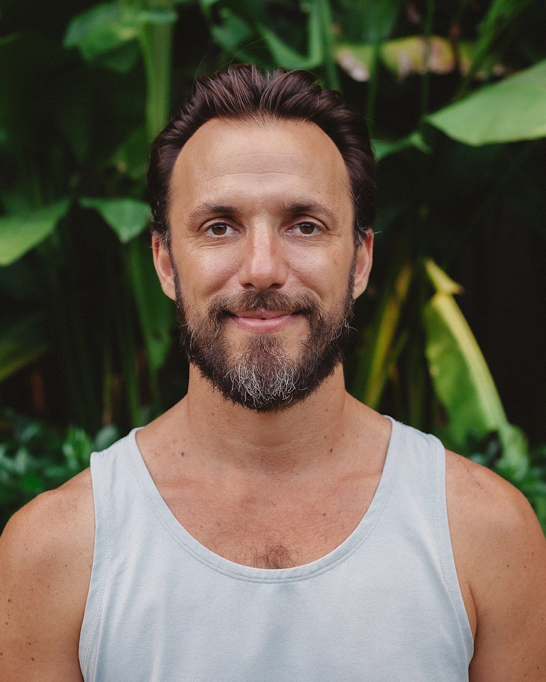 Sean Goldberg, founder of Samasti Yoga, in the garden in Canggu, Bali