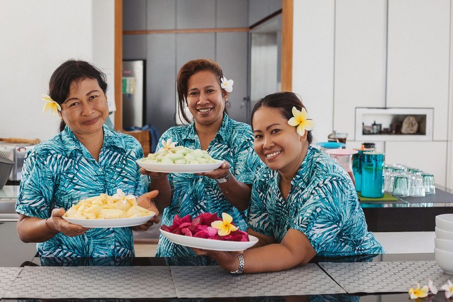Staff serving fresh tropical fruit