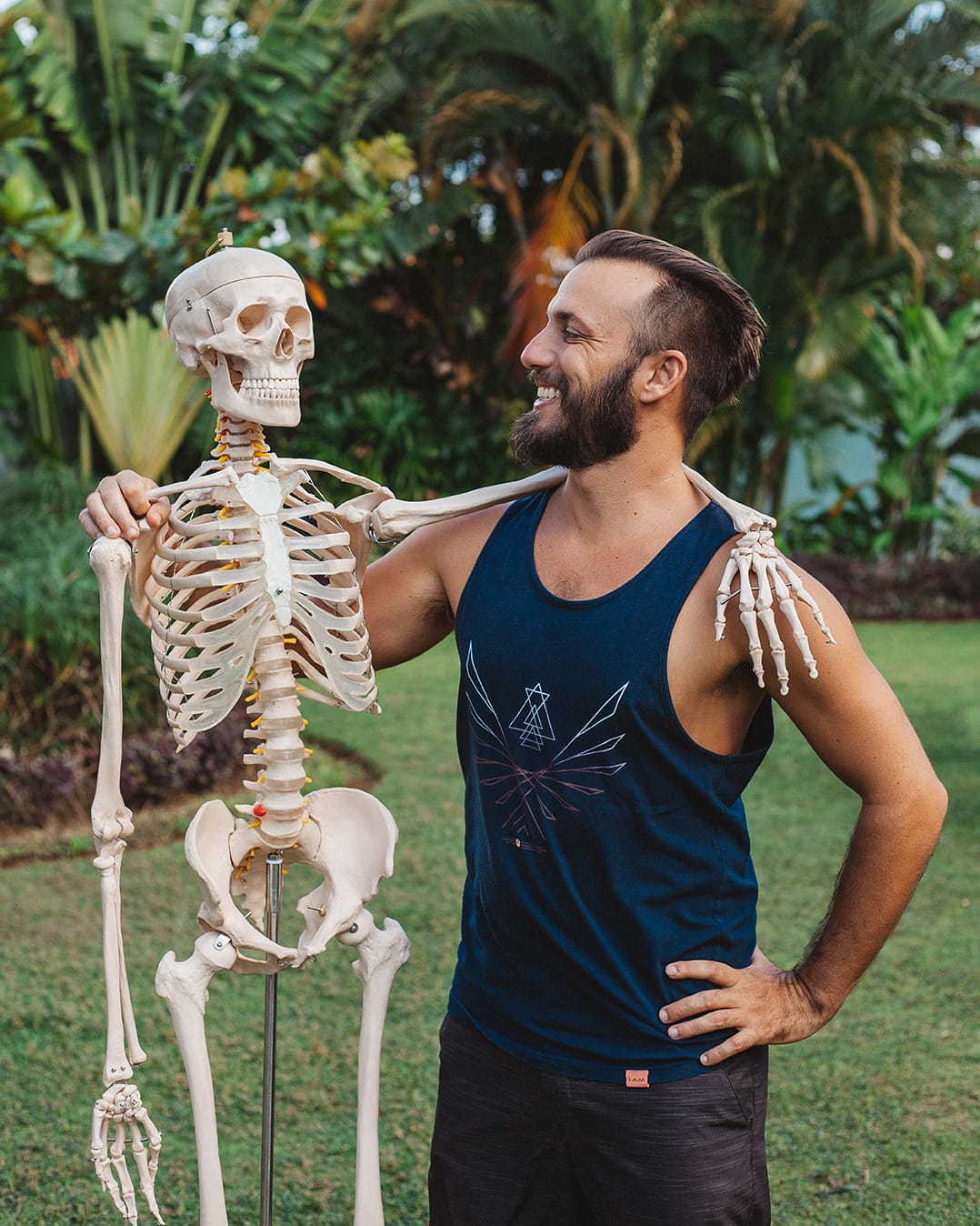 Anatomy at a Bali yoga teacher training taught by a physiotherapist with a full size skeleton model
