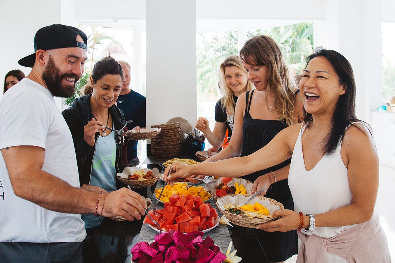 Students and teachers share a fresh tropical fruit buffet together at Samasti Yoga in Canggu Bali