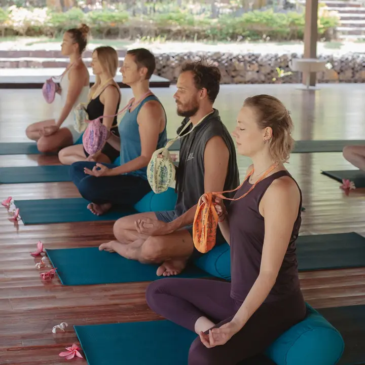 The cohort seated in the shala for meditation