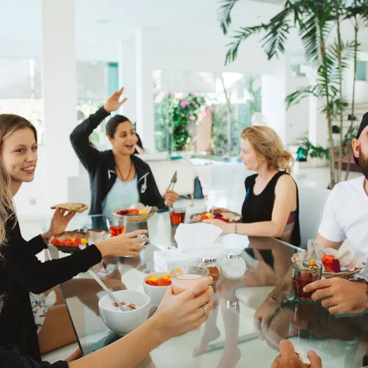 Everyone laughing around the breakfast table
